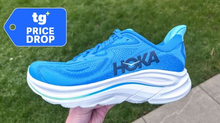 Hoka Clifton 10 sneaker held in hand