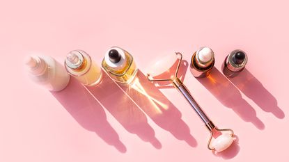 bakuchiol, birds eye view of skincare serums and facial roller