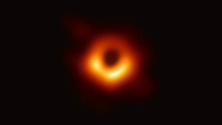 Orange glowing ring surrounding a black circle.