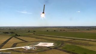 SpaceX's reusable Grasshopper rocket flies sideways during a 100-meter (328-foot) lateral test flight on Aug. 13, 2013 in this still from a video recorded at SpaceX's McGregor, Tex., proving grounds.