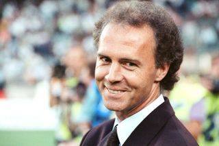 West Germany coach Franz Beckenbauer smiles during the 1990 World Cup semi-final against England.