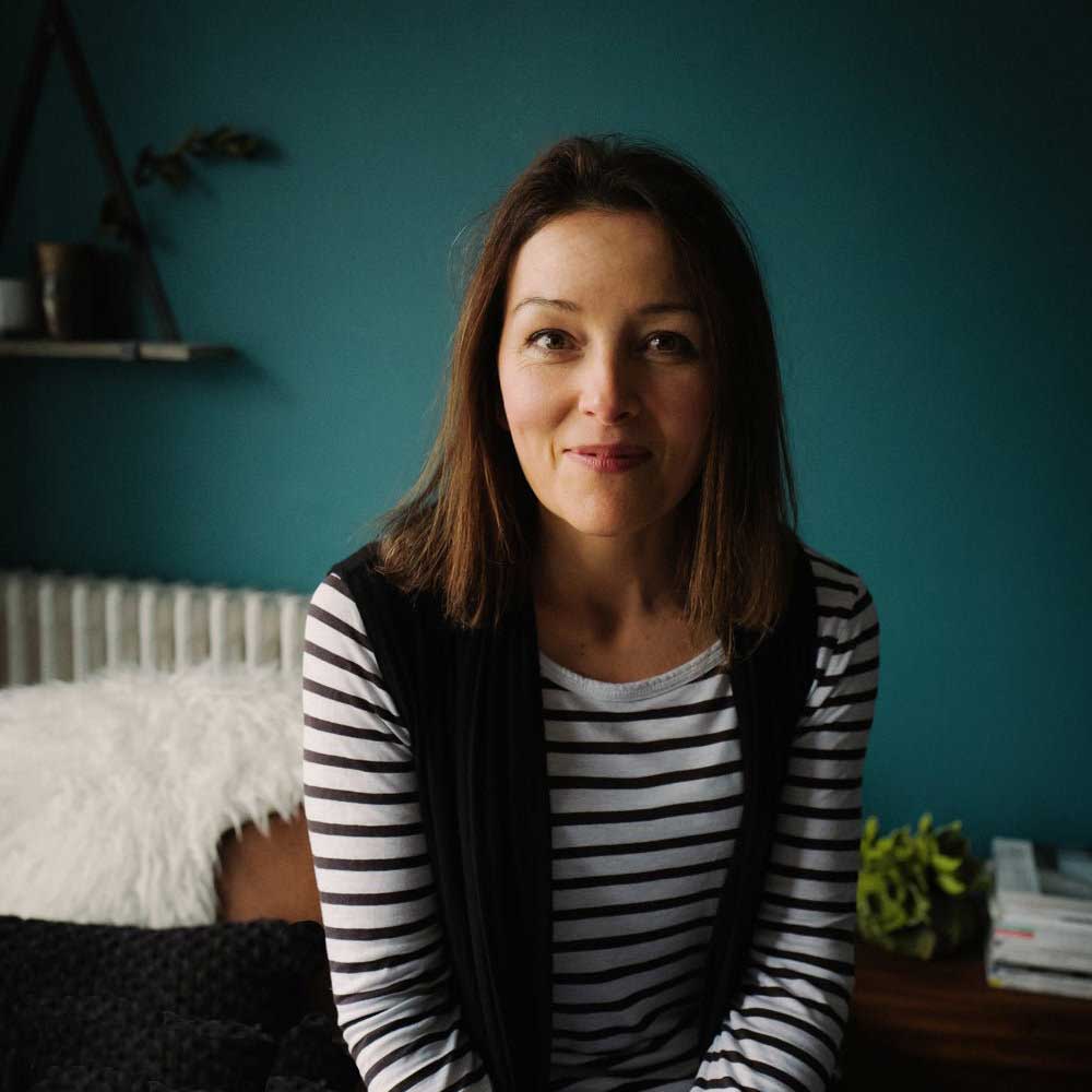 picture of interior designer Fiona Duke a woman with mid length brown hair wearing a striped top