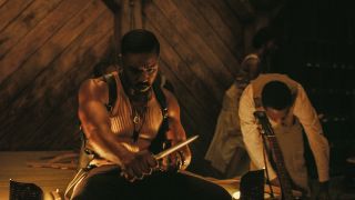 Sinners Michael B. Jordan carving a stake