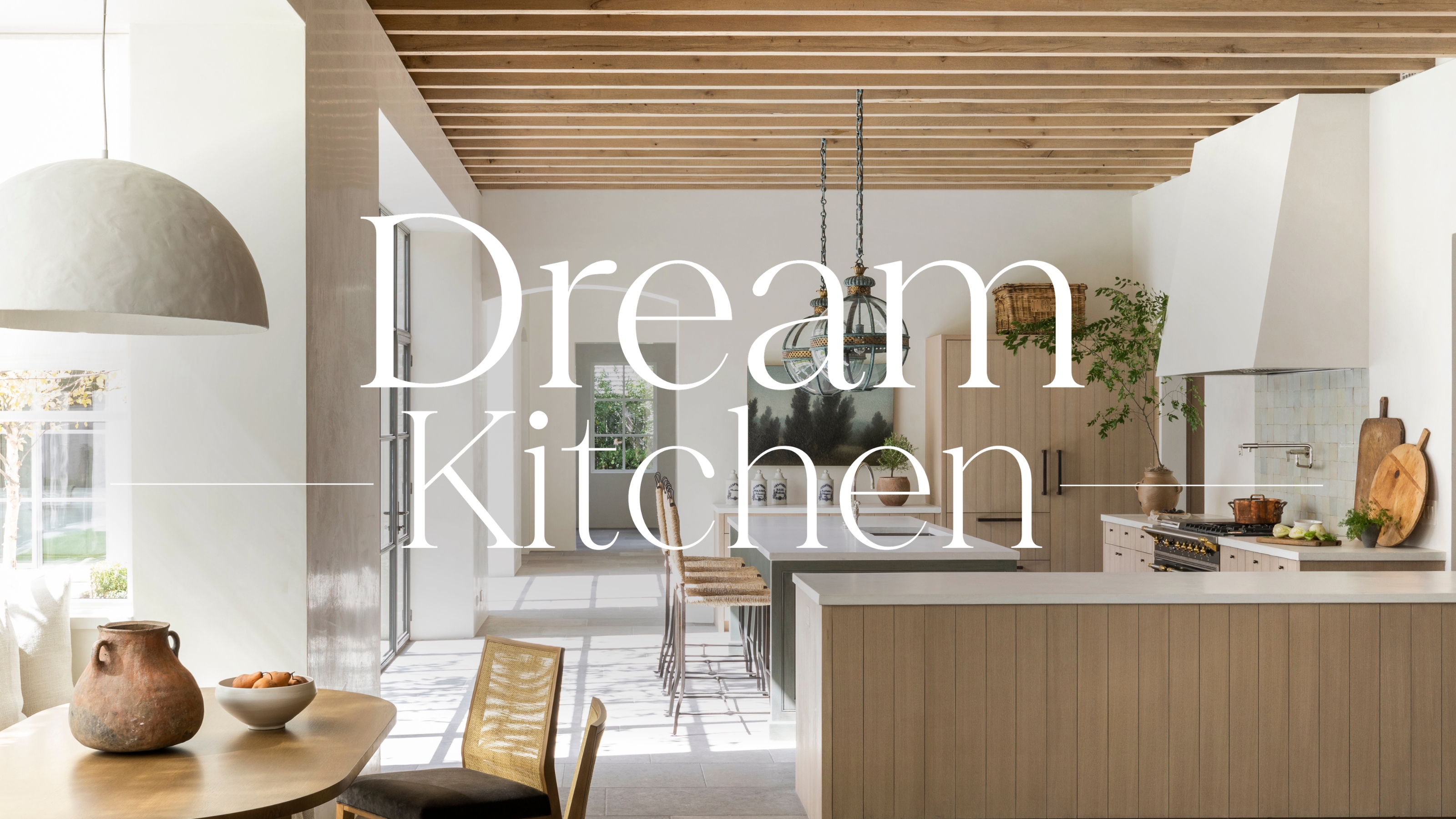 A neutral kitchen with light wood cabinets, white walls, and a 'Dream Kitchen' overlay