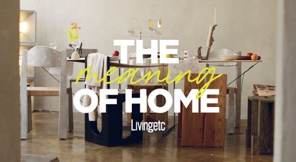 A busy table styled with mismatched chairs in wood, matte chrome, and stools in a similar contrasting vibe, topped by fruit, melty candelabra, and lots of objects.