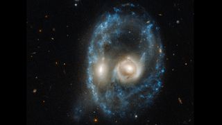 The Hubble Space Telescope's Advanced Camera for Surveys captured this image of two merging galaxies collectively known as Arp-Madore 2026-42.