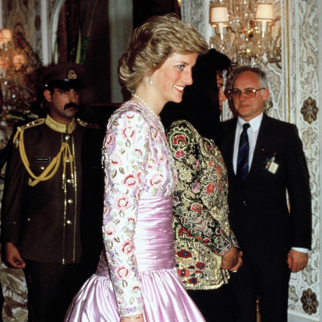 Princess Diana wearing a lilac gown and smiling