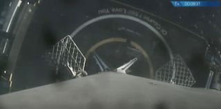 The first stage of a SpaceX Falcon 9 rocket rests on the deck of the drone ship "Of Course I Still Love You" shortly after launching NASA's TESS exoplanet satellite on April 18, 2018.