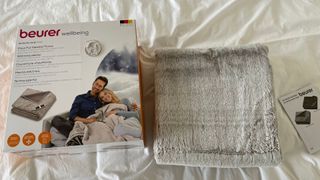 Beurer HD 150 XXL Nordic Electric Blanket unboxed on top of the bed