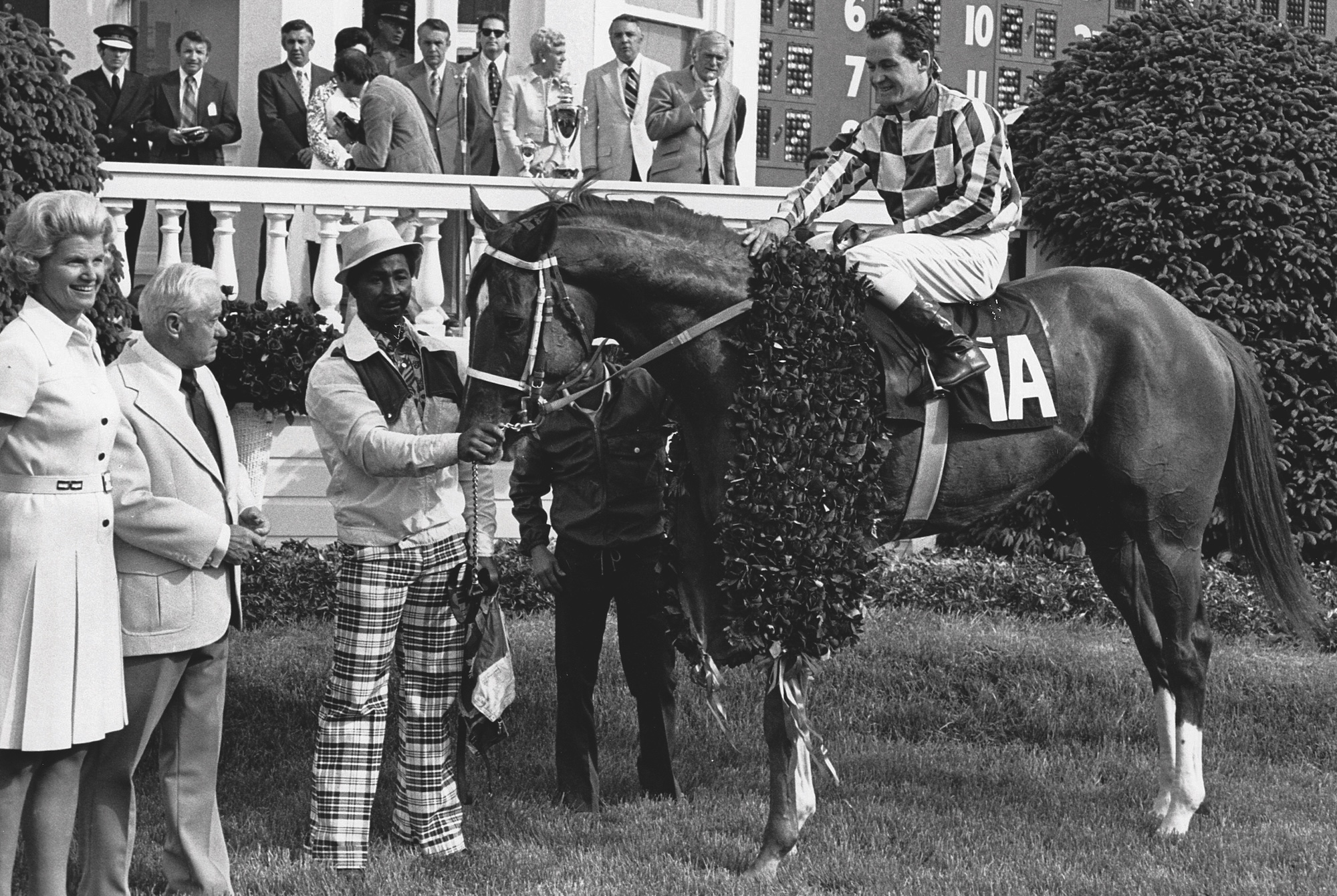 Secretariat with groom and wreath after winning the Kentucky Derby