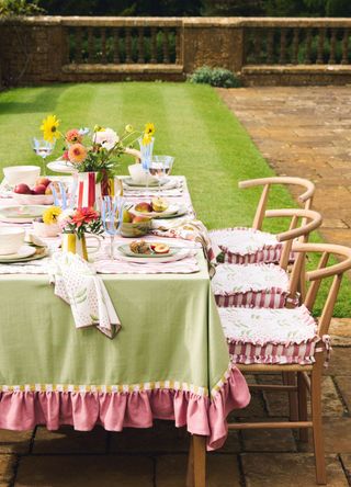 picture of dining table set out in garden with collection