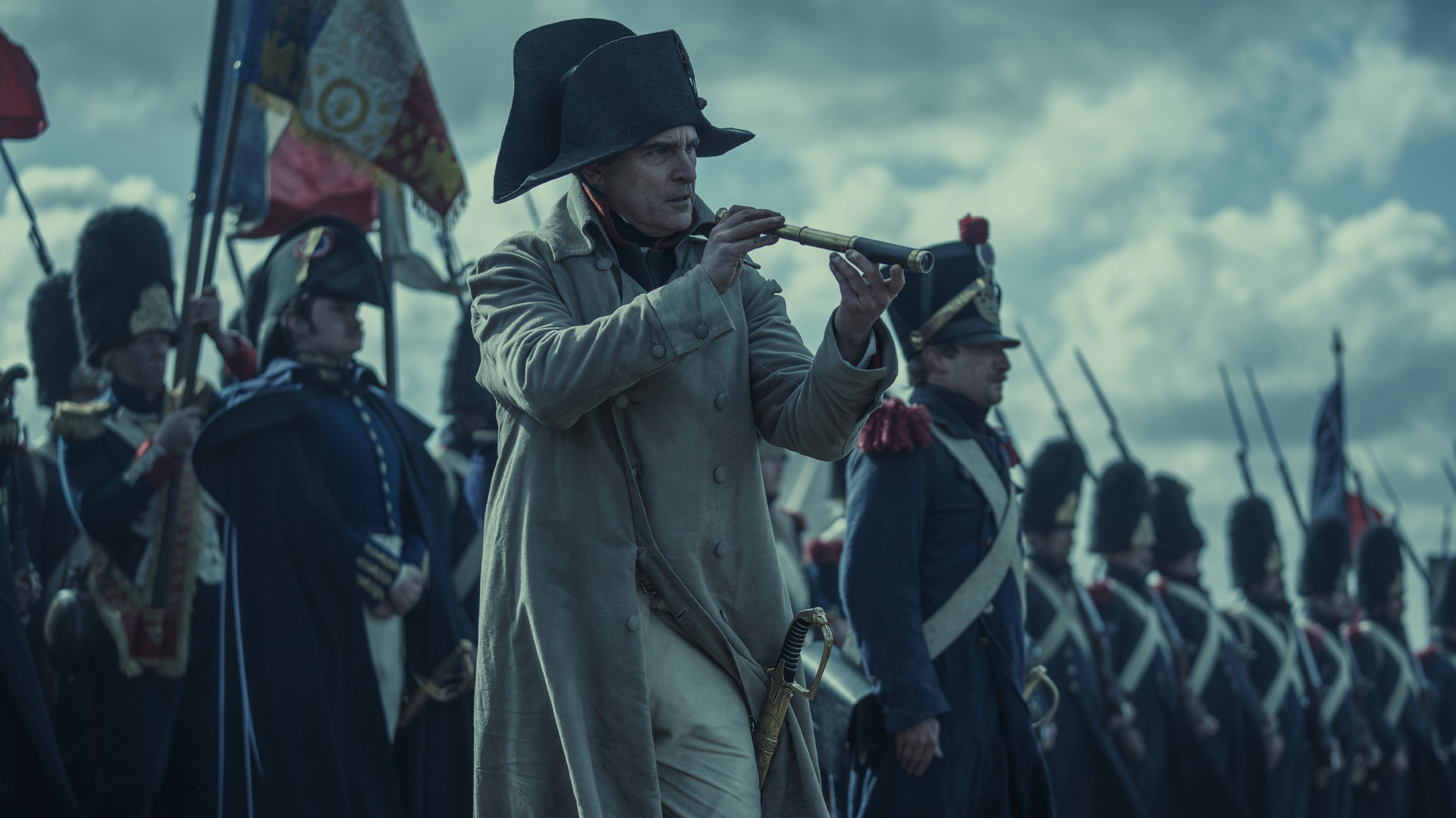 Napoleon Bonaparte looks through a telescope next to his troops in his self-titled Ridley Scott-directed film