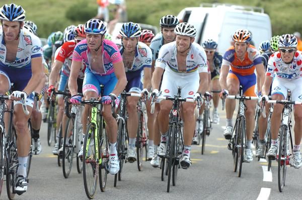 Thor Hushovd and Alessandro Petacchi come to the line inside the 'bus'