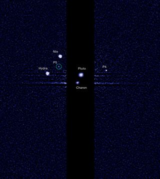Pluto and its five moons – as seen from the Hubble Space Telescope in July, 2012.