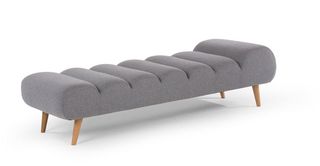 Grey day bed with wooden legs