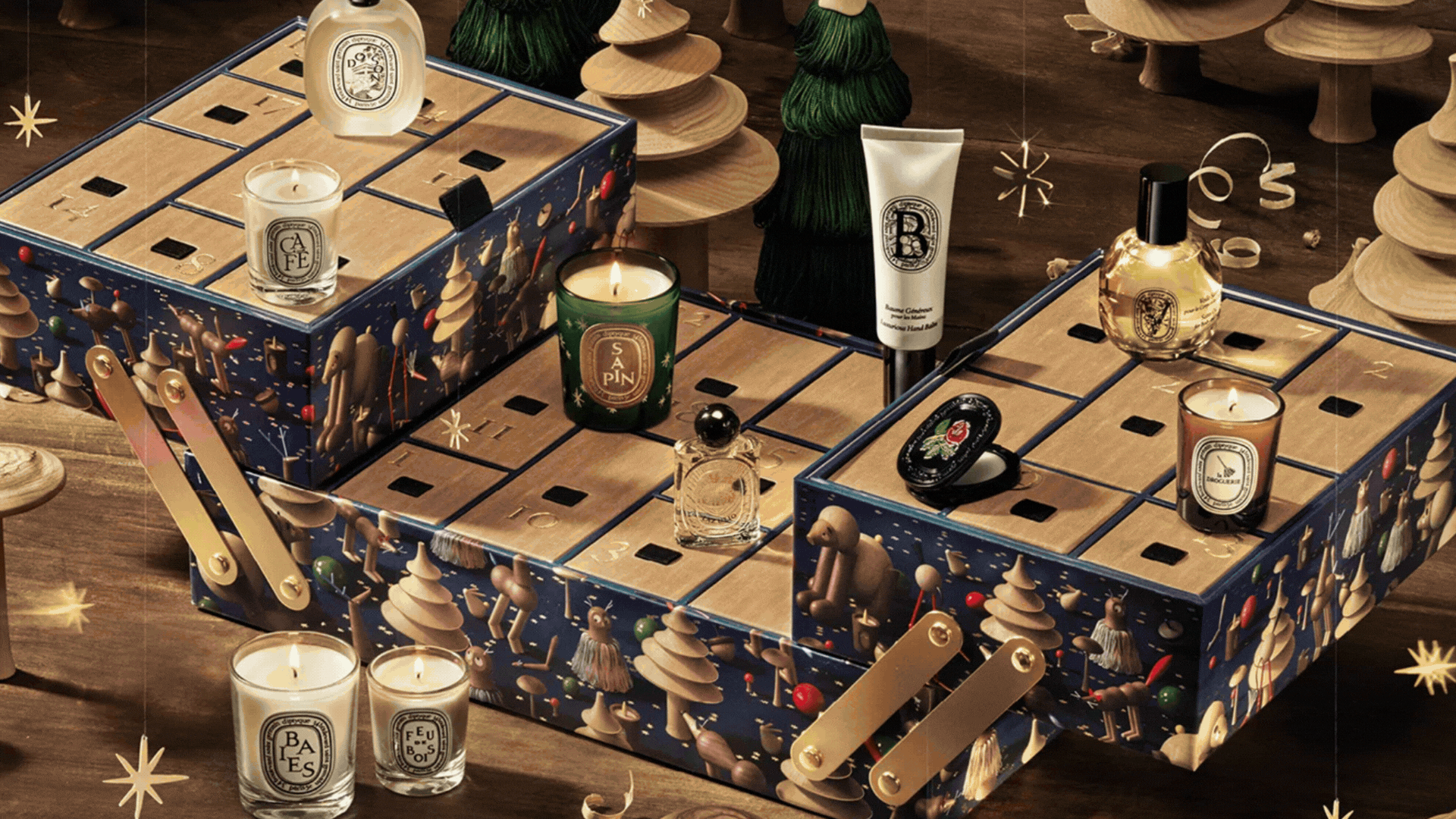 A GIF of Christmas home fragrance advent calendars from Diptyque, Jo Malone London, M&S x Kelly Hoppen, Voluspa, and The White Company