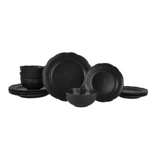 Black plates and bowls on white background