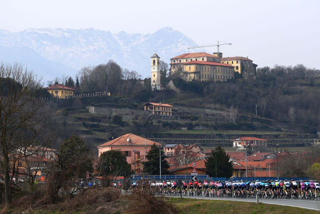MILAN ITALY MARCH 16 A general view of the Peloton passing through Bollengo Village 243m during the 103rd MilanoTorino 2022 a 197km one day race from Magenta to Rivoli MilanoTorino on March 16 2022 in Milan Italy Photo by Tim de WaeleGetty Images
