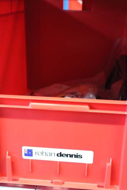 A few national champion skin suits sit in Rohan Dennis' cubby