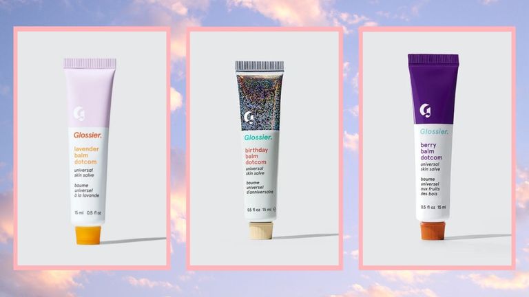 three of the Glossier Balm Dotcom lip balms in Lavender, Birthday and Berry in a cloud template
