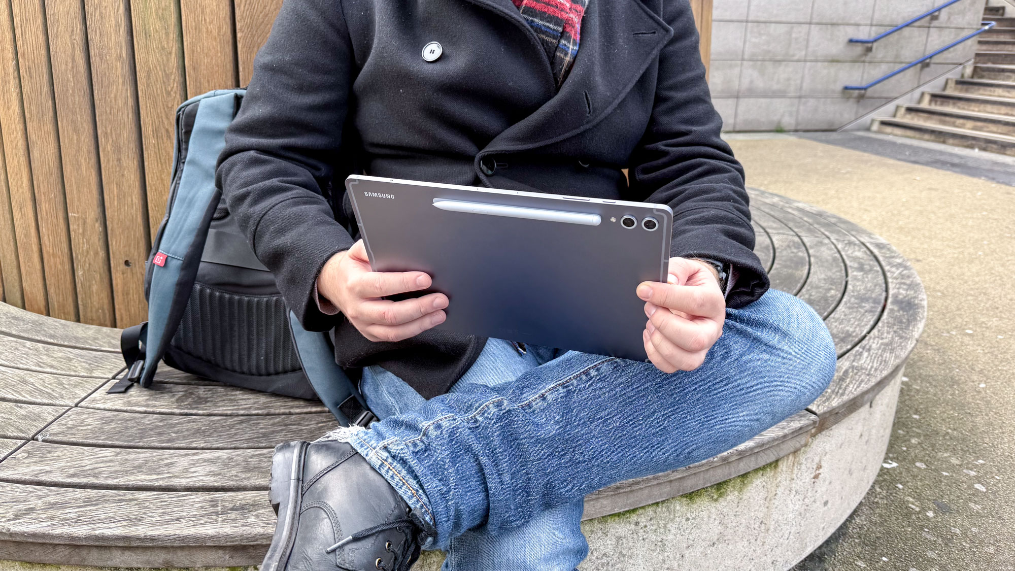 Samsung Galaxy Tab S10 Plus from behind with stylus, being held in hand