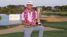 Jordan Gumberg holding the Hainan Classic trophy