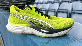 Puma Velocity Nitro 3 side on view on a wall at a running track