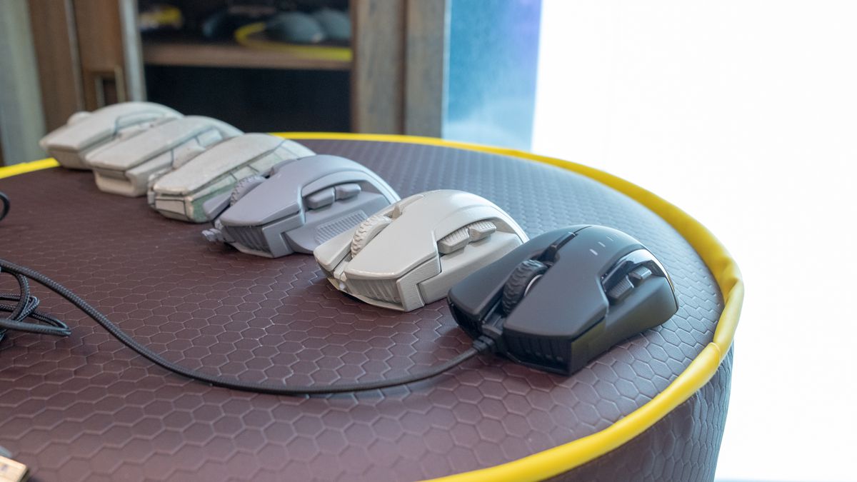 The final Corsair Glaive RGB next to its initial prototypes