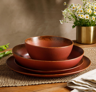 Clay red stoneware plates and bowls.