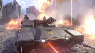 A Bastion tank rolling through a city street surrounded by explosions in Helldivers 2.