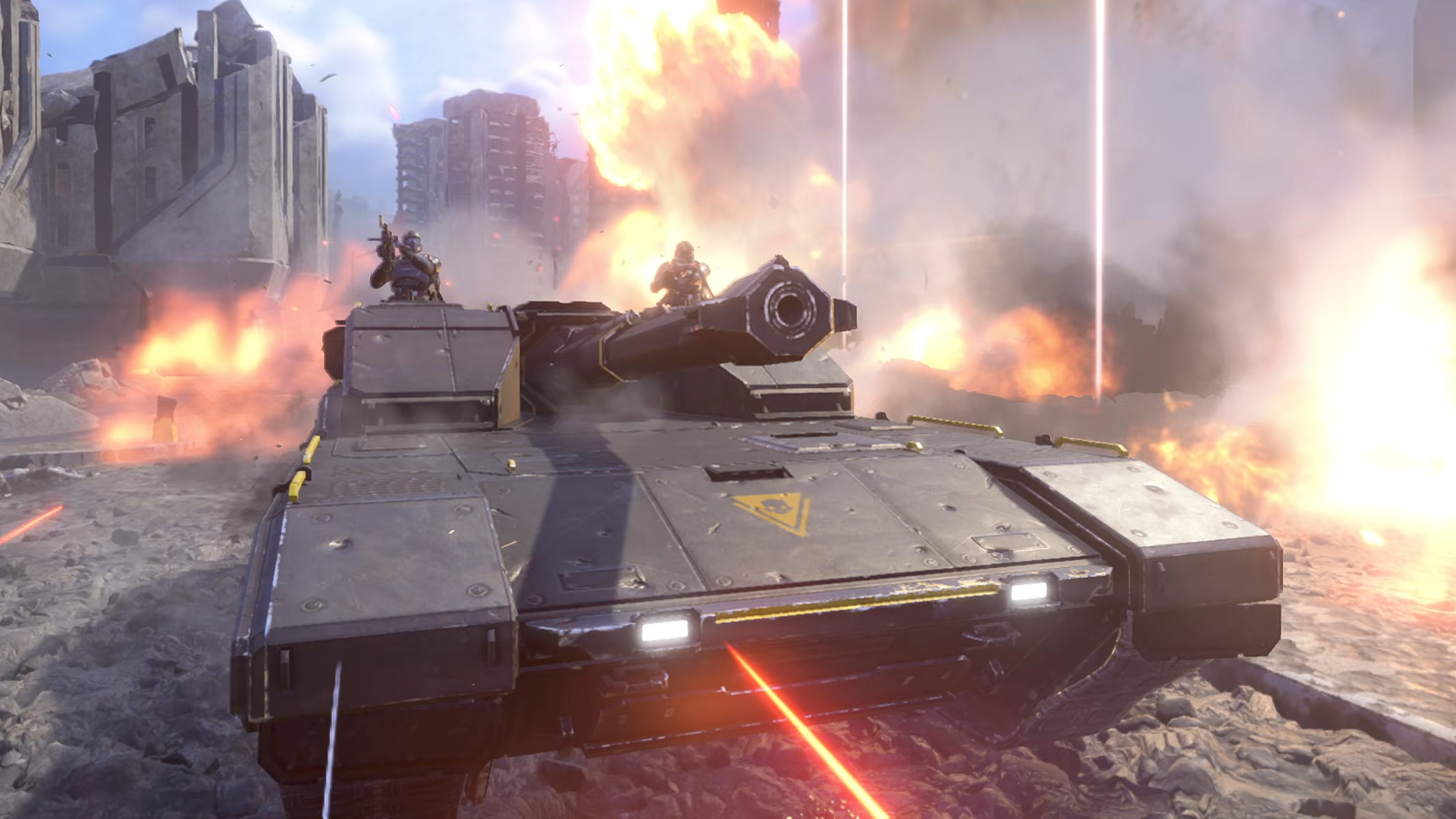 A Bastion tank rolling through a city street surrounded by explosions in Helldivers 2.