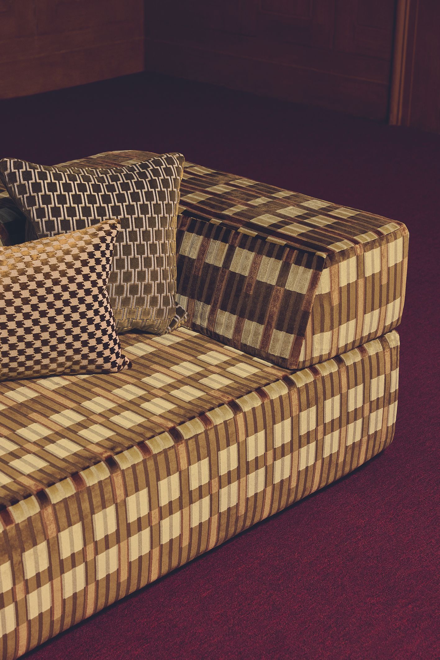 a sofa in a modern olive green checker