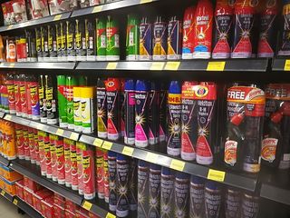 Insecticide products on a store shelf.