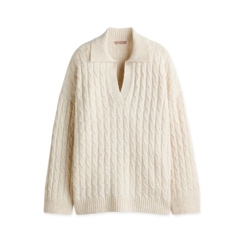A cutout of a H&amp;amp;M cable knit cream jumper
