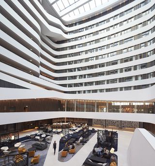 Centre of the hotel with a large lounge area at the bottom of the many-storey building