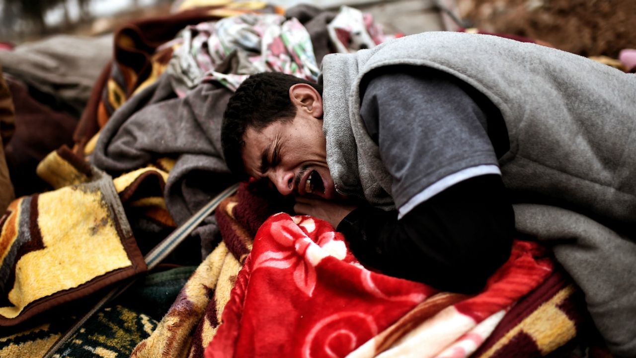 Relatives mourn as bodies of Iraqi residents of west Mosul killed in an airstrike targeting Islamic State (IS) group jihadist