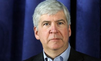 Gov. Rick Snyder (R-Mich.) signed a new law that was immediately rebuked by union leaders because it empowers emergency fiscal managers who could void union contracts.