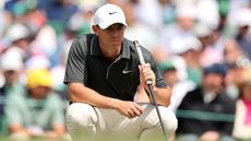 Rory McIlroy reads a putt