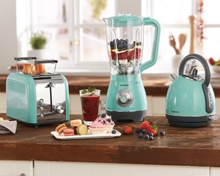turquoise toaster kettle and mixer on brown worktop