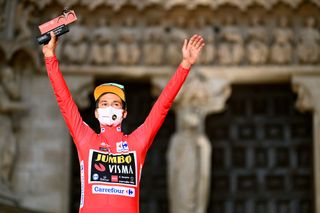 BURGOS SPAIN AUGUST 14 Primoz Roglic of Slovenia and Team Jumbo Visma celebrates winning the red leader jersey on the podium ceremony after the 76th Tour of Spain 2021 Stage 1 a 71km individual time trial from Burgos Catedral de Santa Mara to Burgos lavuelta LaVuelta21 CapitalMundialdelCiclismo catedral2021 on August 14 2021 in Burgos Spain Photo by Stuart FranklinGetty Images