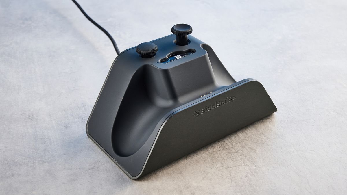 The SteelSeries Aeon Pro on a stone surface against a blue background