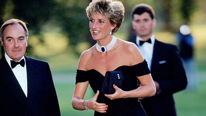 Lord Palumbo greets Princess Diana, wearing a short black cocktail dress designed by Christina Stambolian, as she atttends a Gala at the Serpentine Gallery in Hyde Park