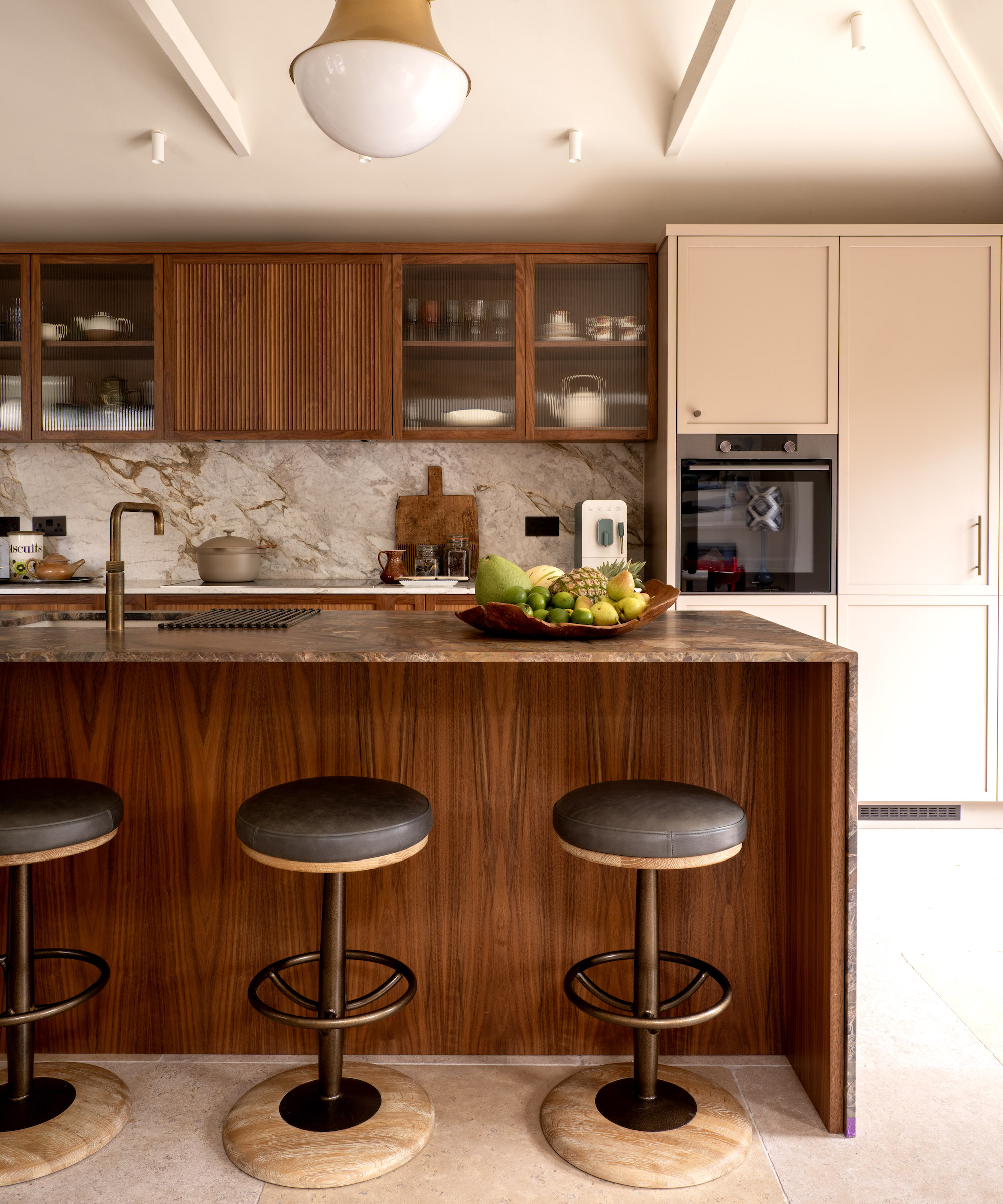walnut kitchen island with three bar stools