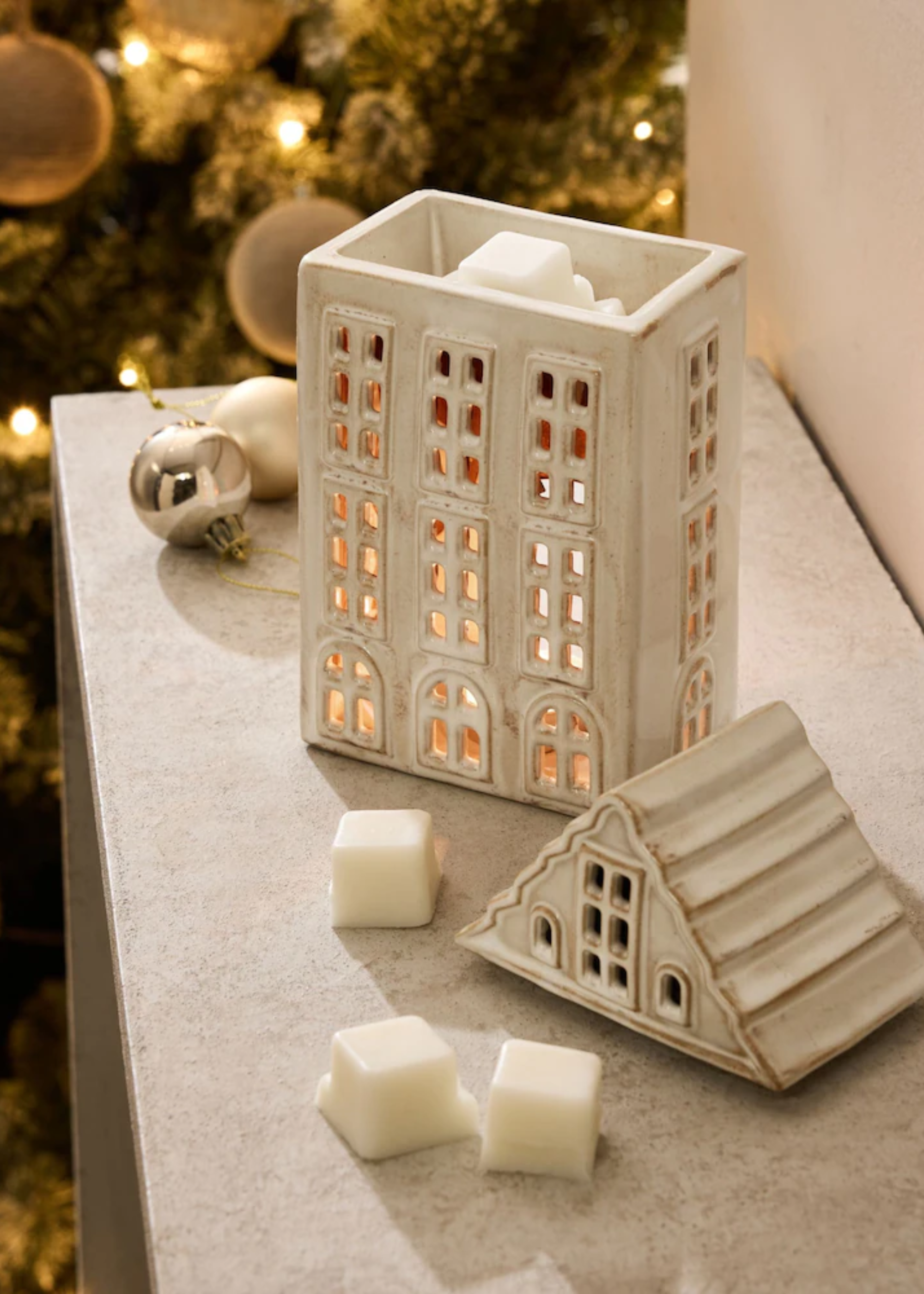 A ceramic house with a wax melt burner