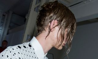 The greased hairstyle of model
