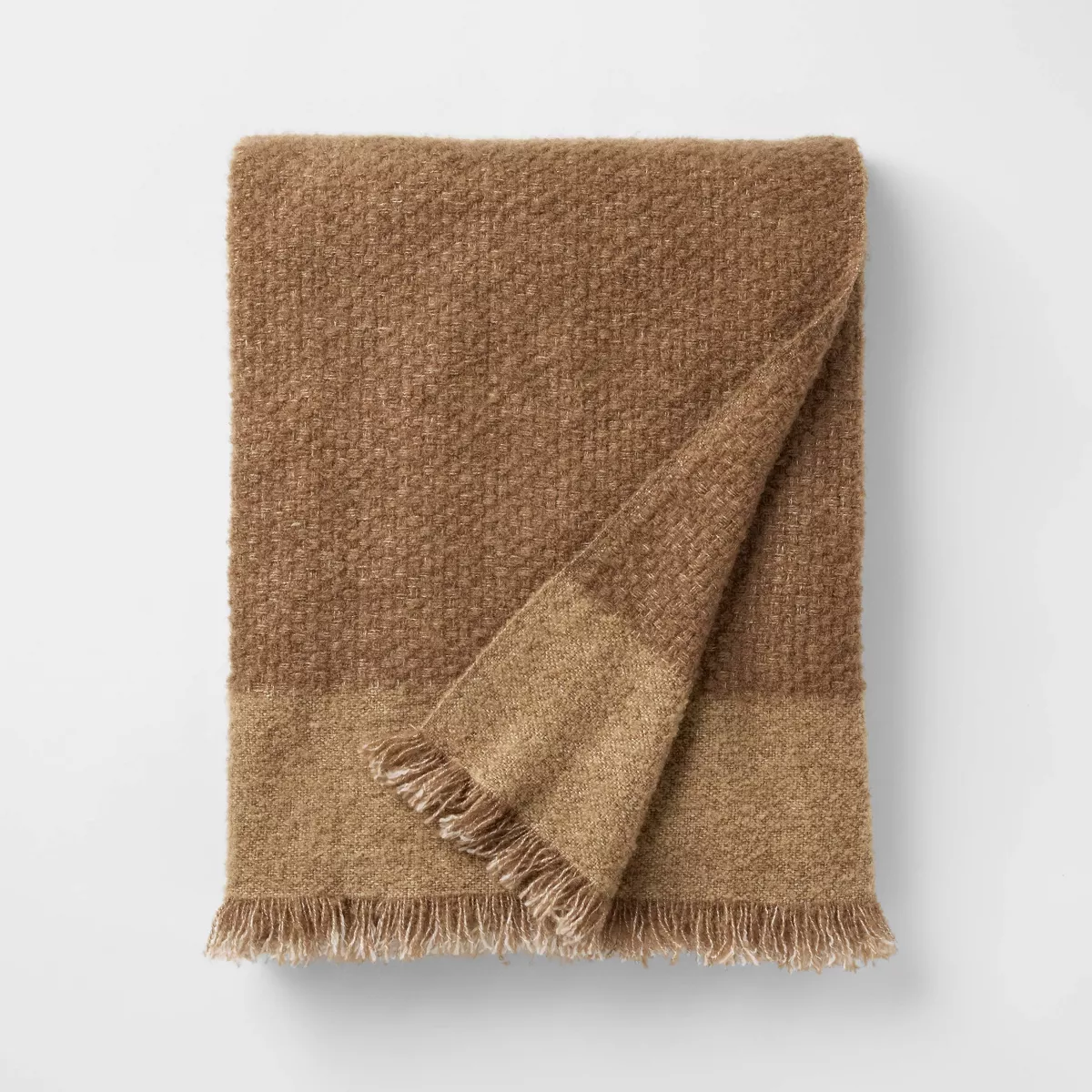 Tan boucle throw pillow