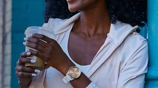 Woman wearing Garmin Vivomove Trend watch