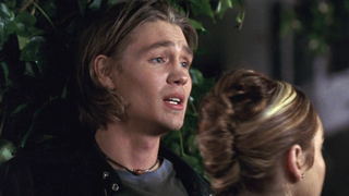 Chad Michael Murray against a bush with Lindsay Lohan in Freaky Friday