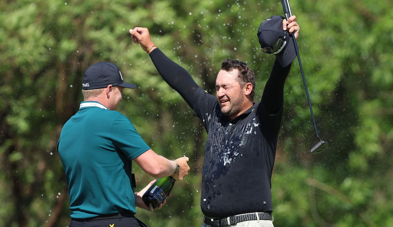 Lawrence gets sprayed with champagne 