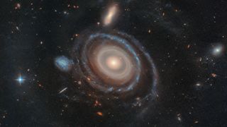 an illustration of a galaxy with concentric rings